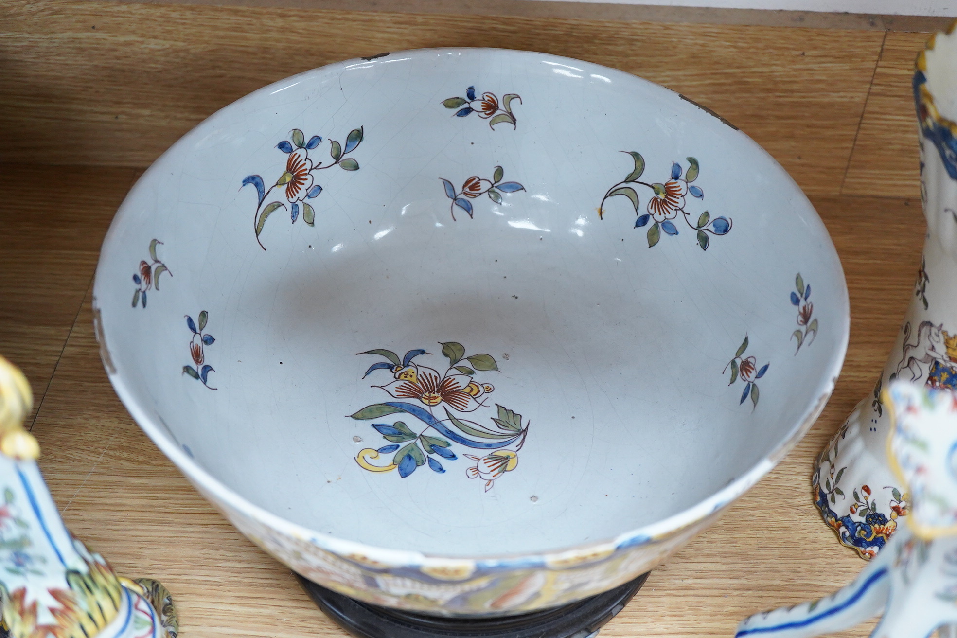 18th and 19th century faience including five chargers and large bowl, latter 30cm